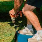 Ground Puppies Screw in Peg being screwed into a caravan mat
