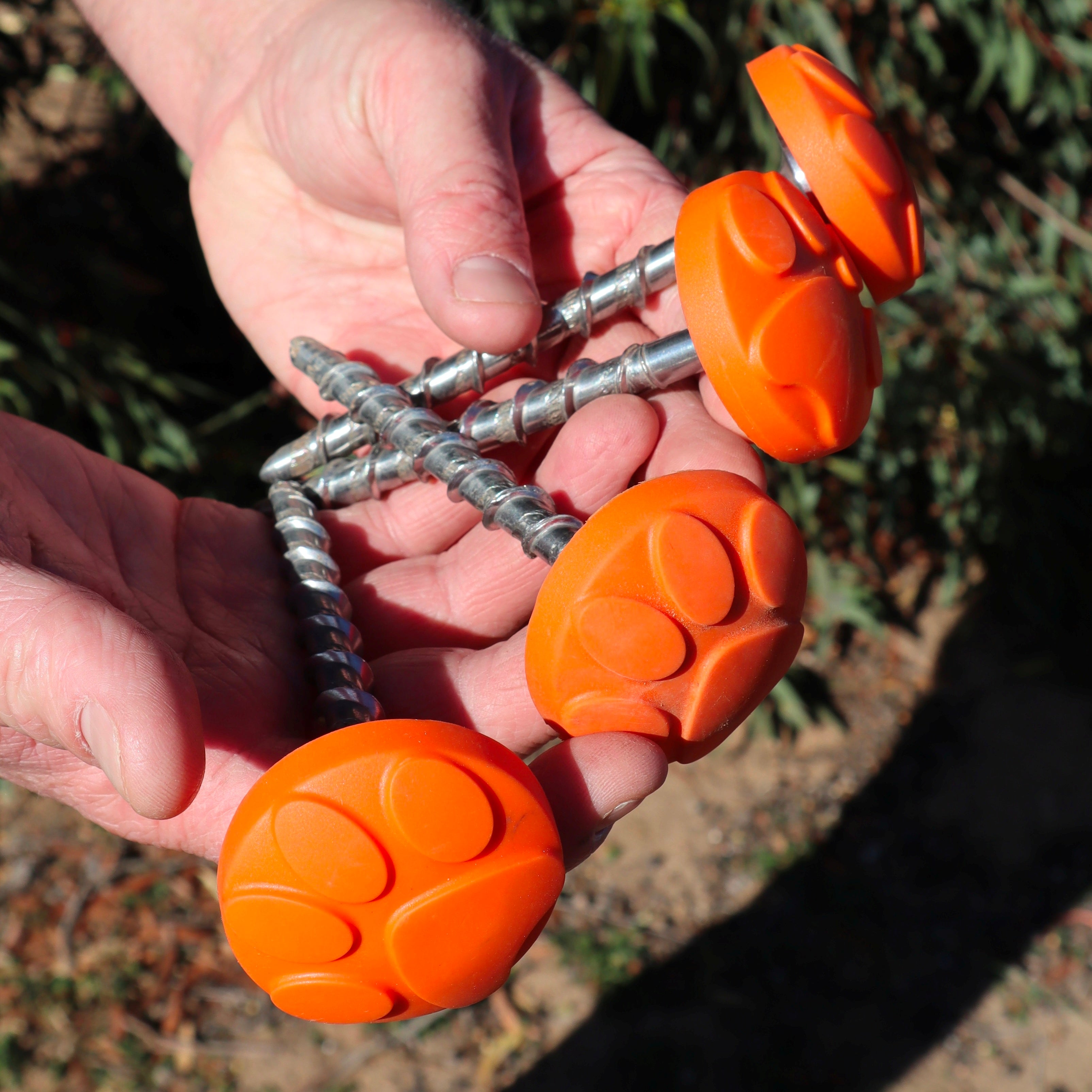 4 Ground puppy Screw in Mat Pegs with orange protective caps